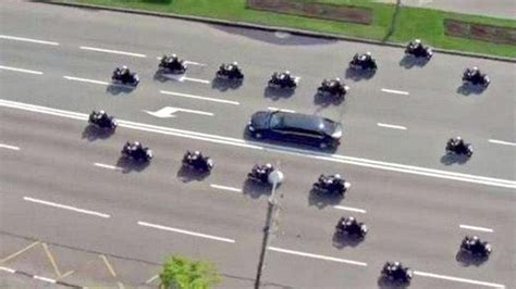 aerial photo of english police escort donald trump  The charges are the result